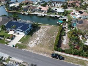 an aerial view of a house with ocean view