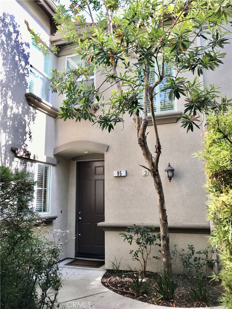 a house with a tree in front of it