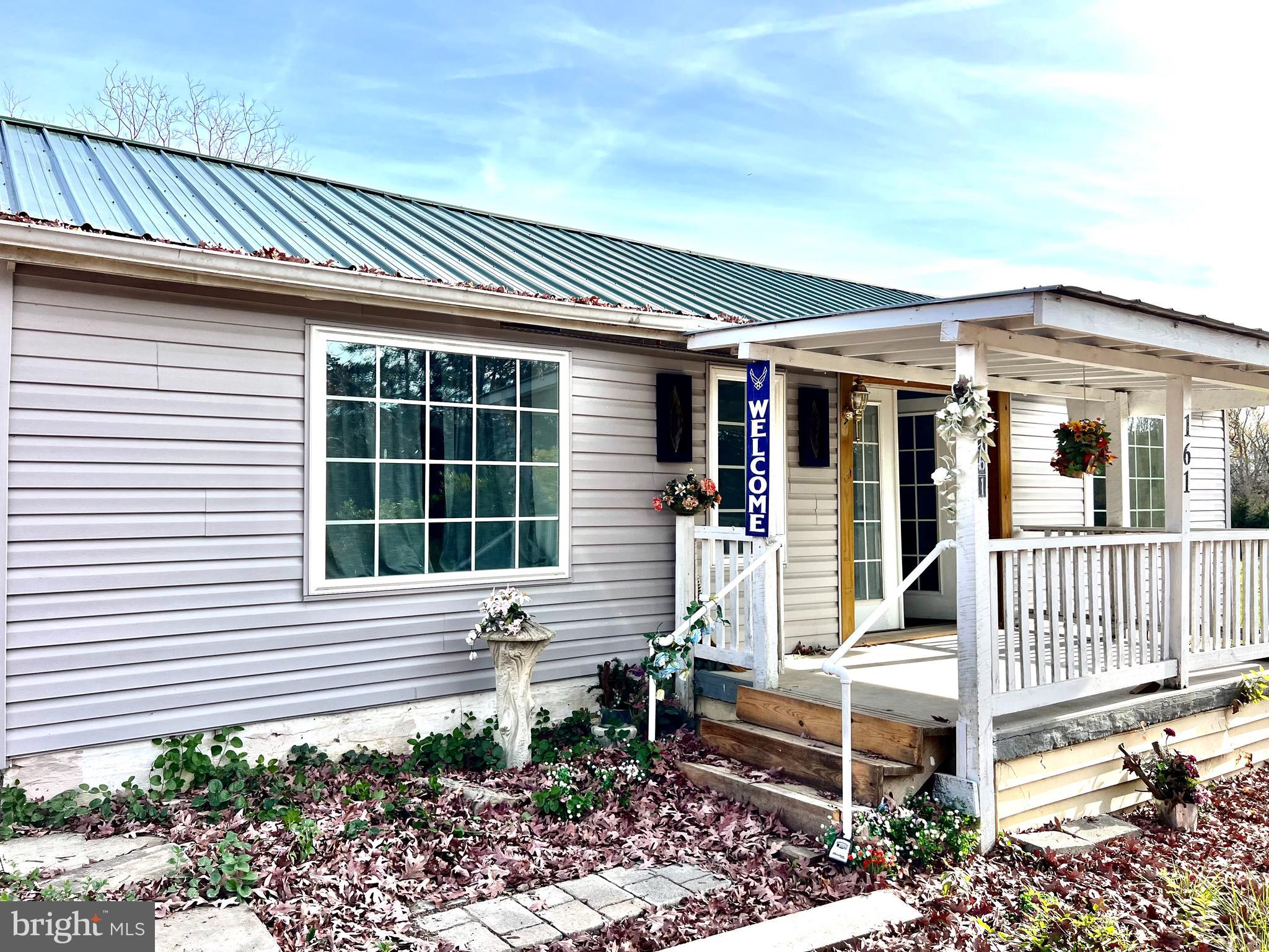 a front view of a house with a porch