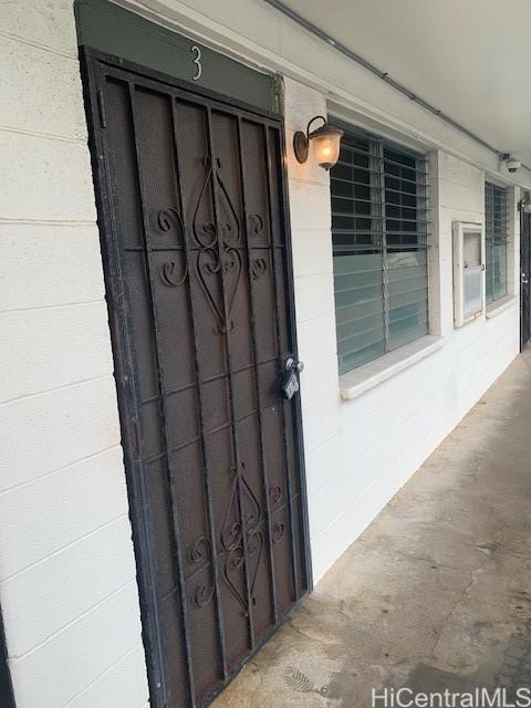 a view of a door and a window