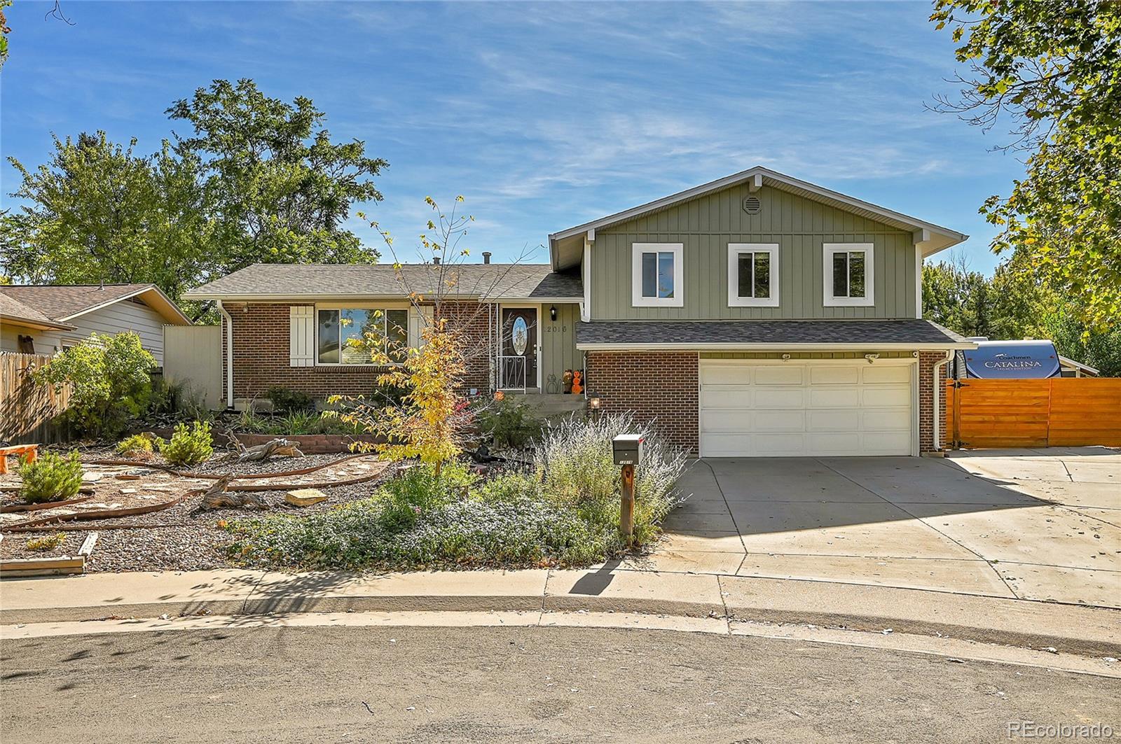 a front view of a house with garage