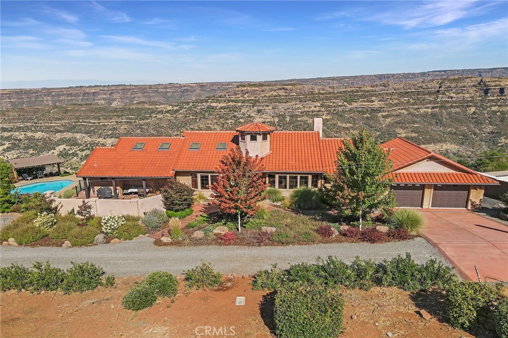 an aerial view of a house with a ocean view