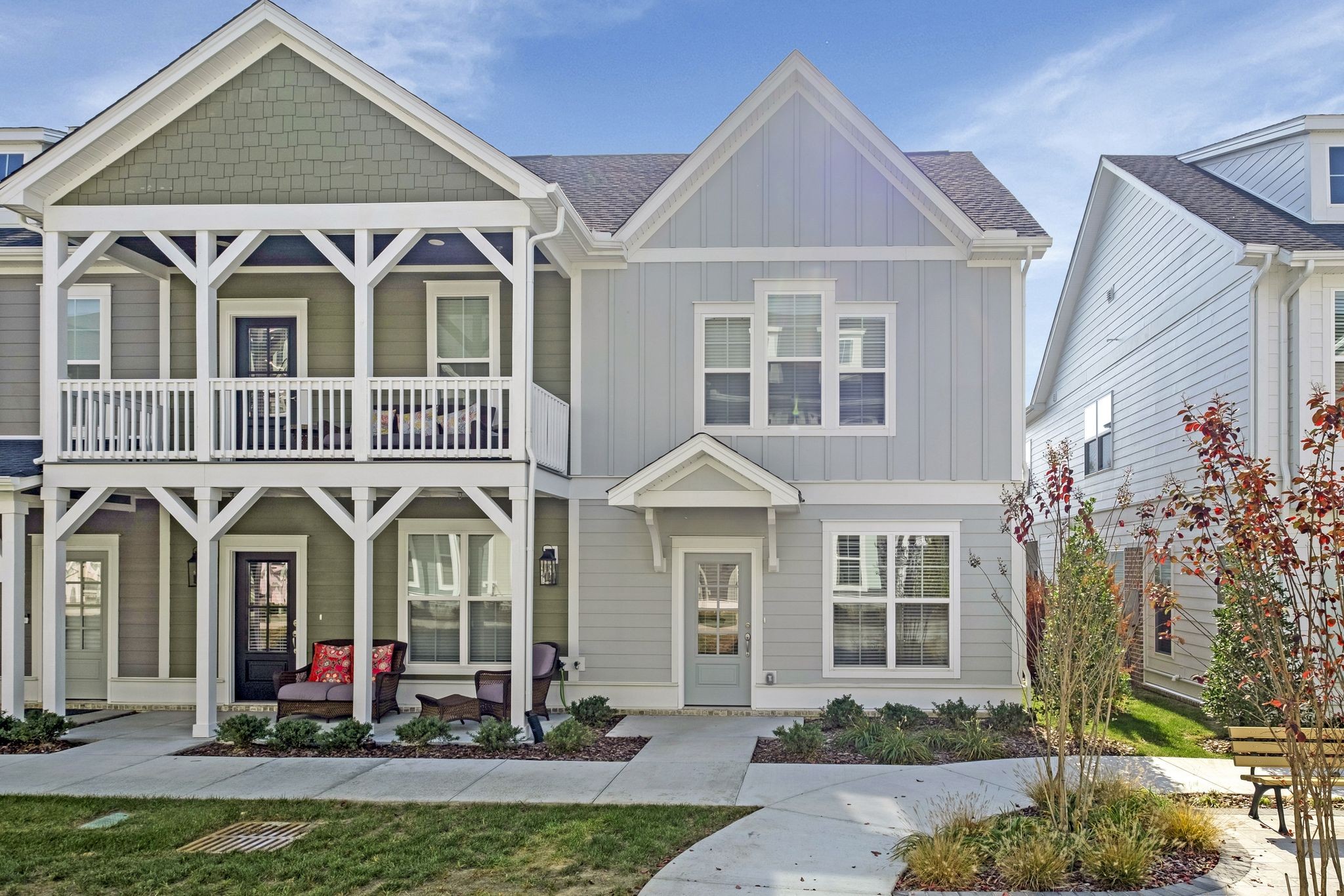 a front view of a residential houses with yard