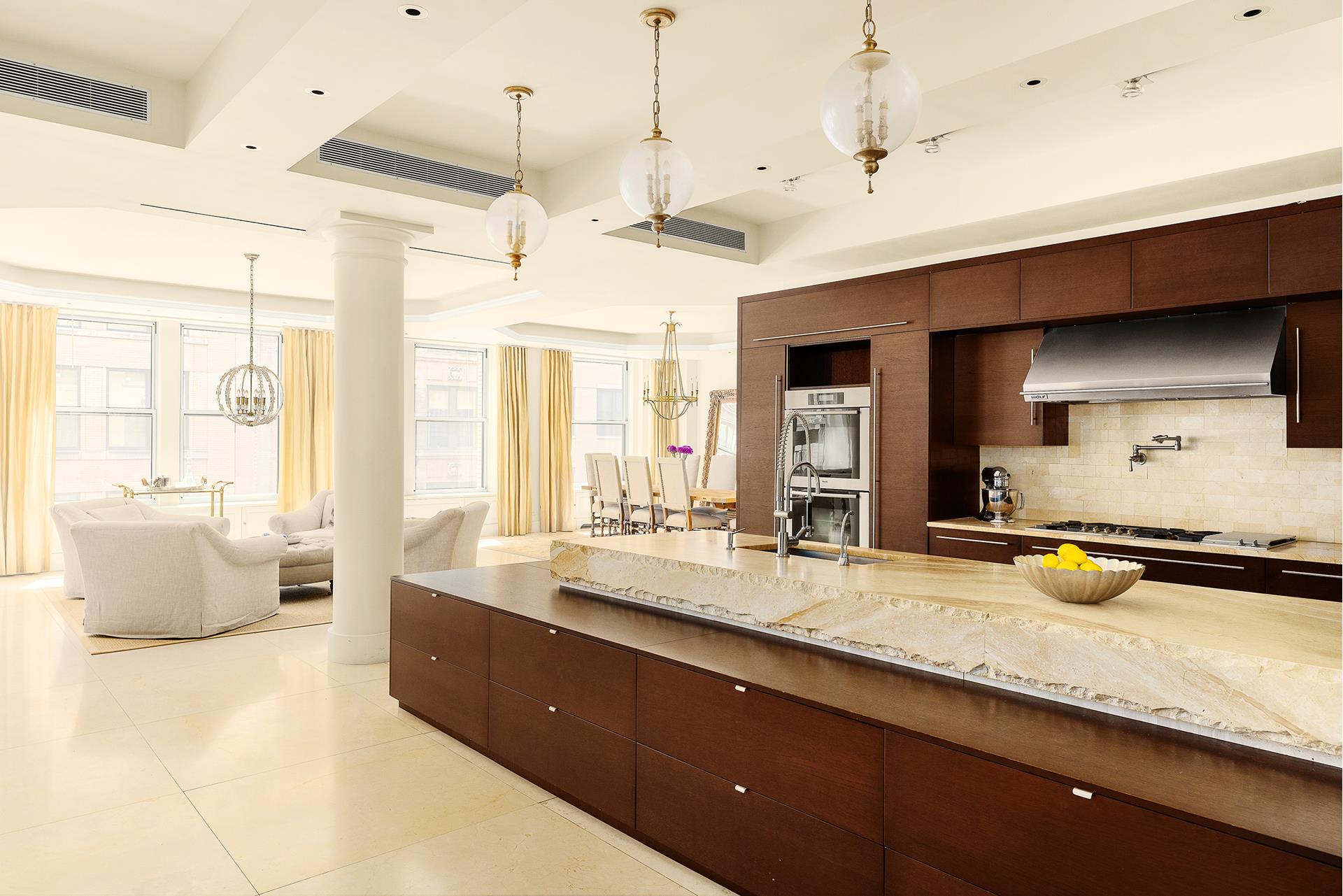 a large kitchen with a large window and counter space