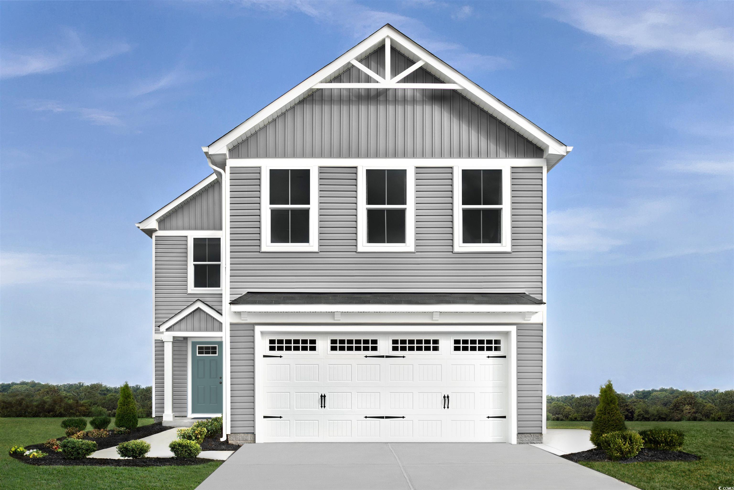 View of front facade with a garage