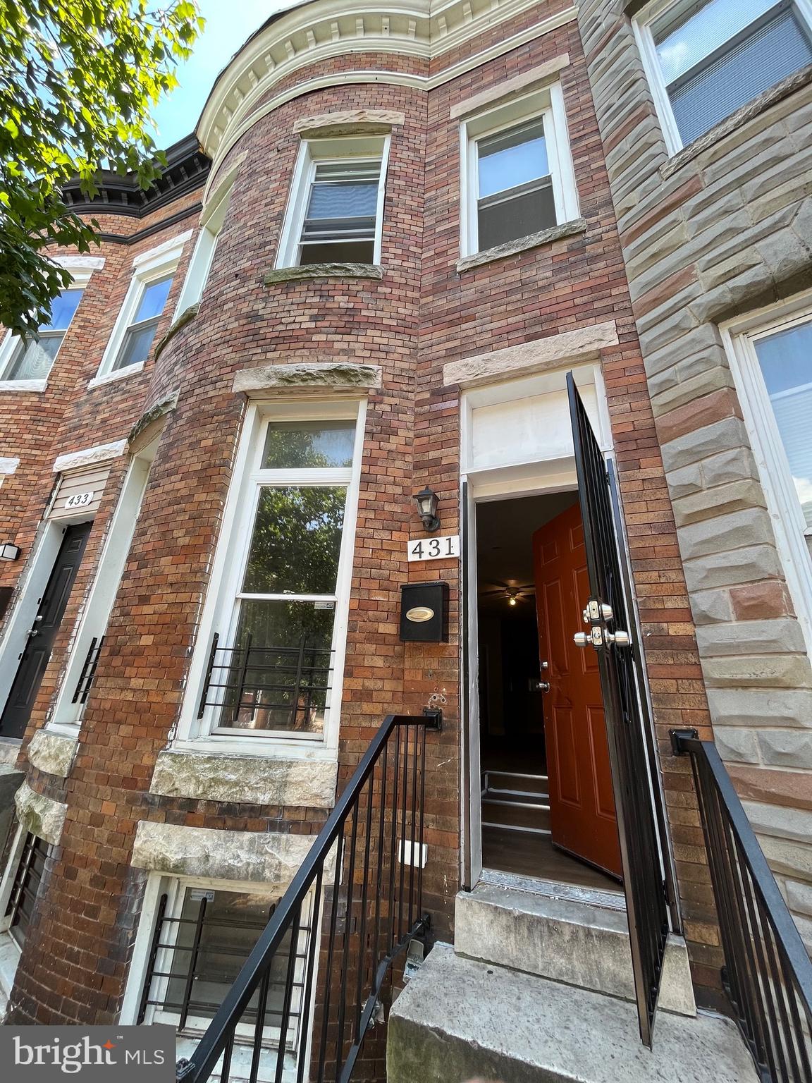 a view of a brick house with a large window