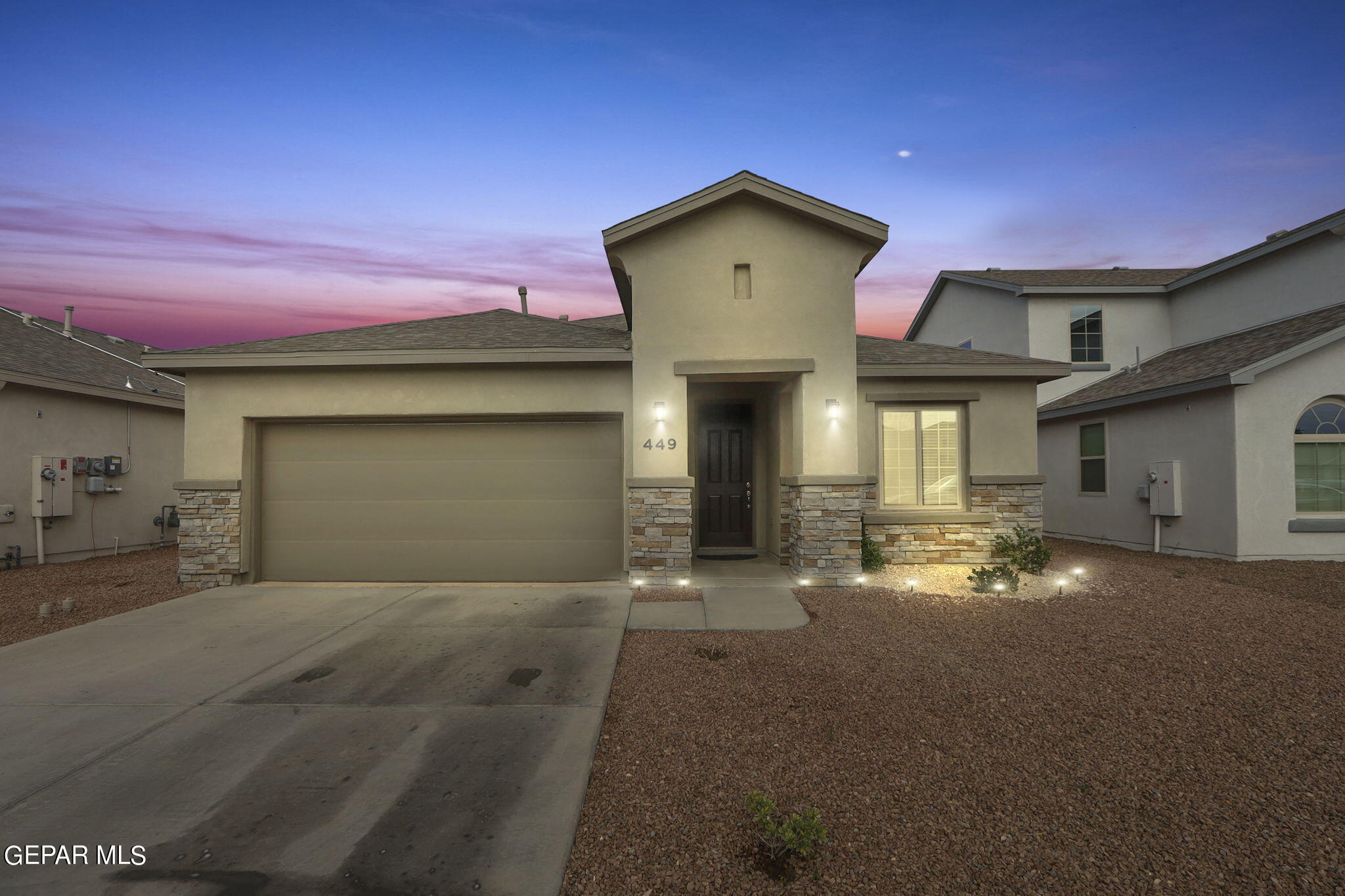 a view of a house with a yard and garage