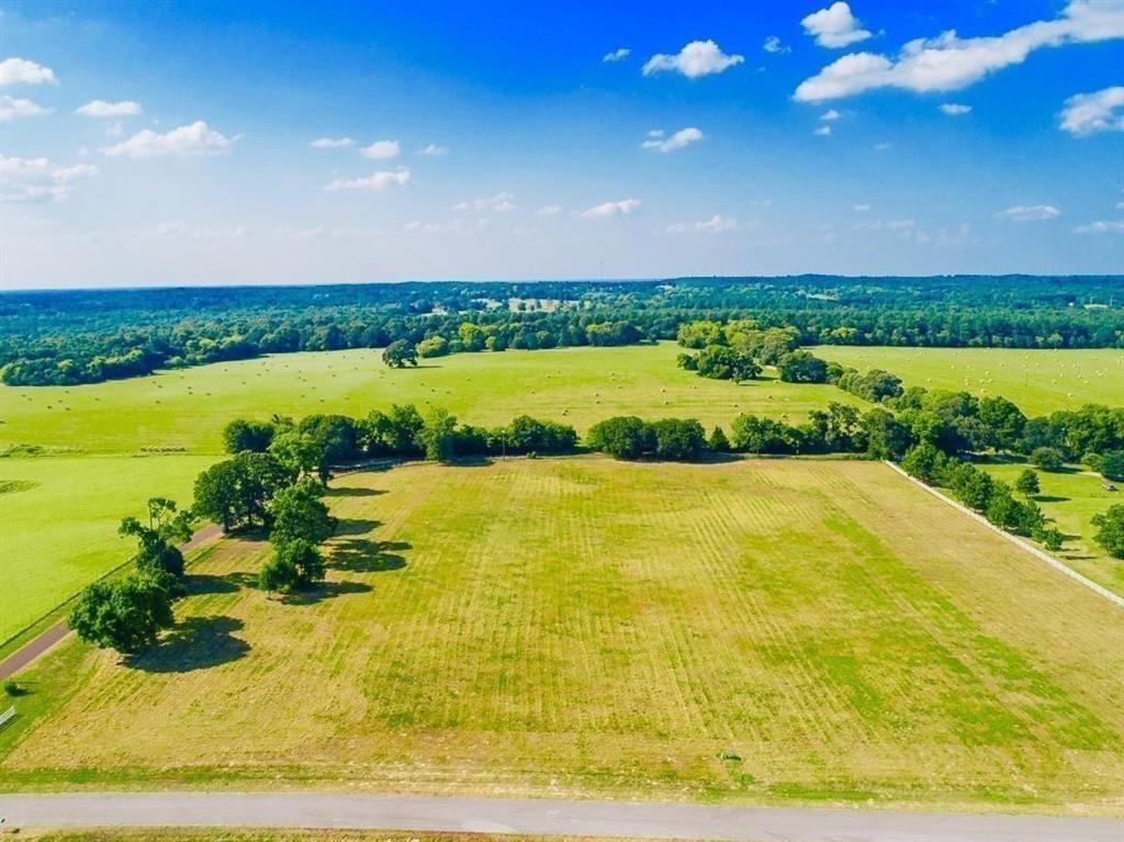 a view of a lake with a big yard