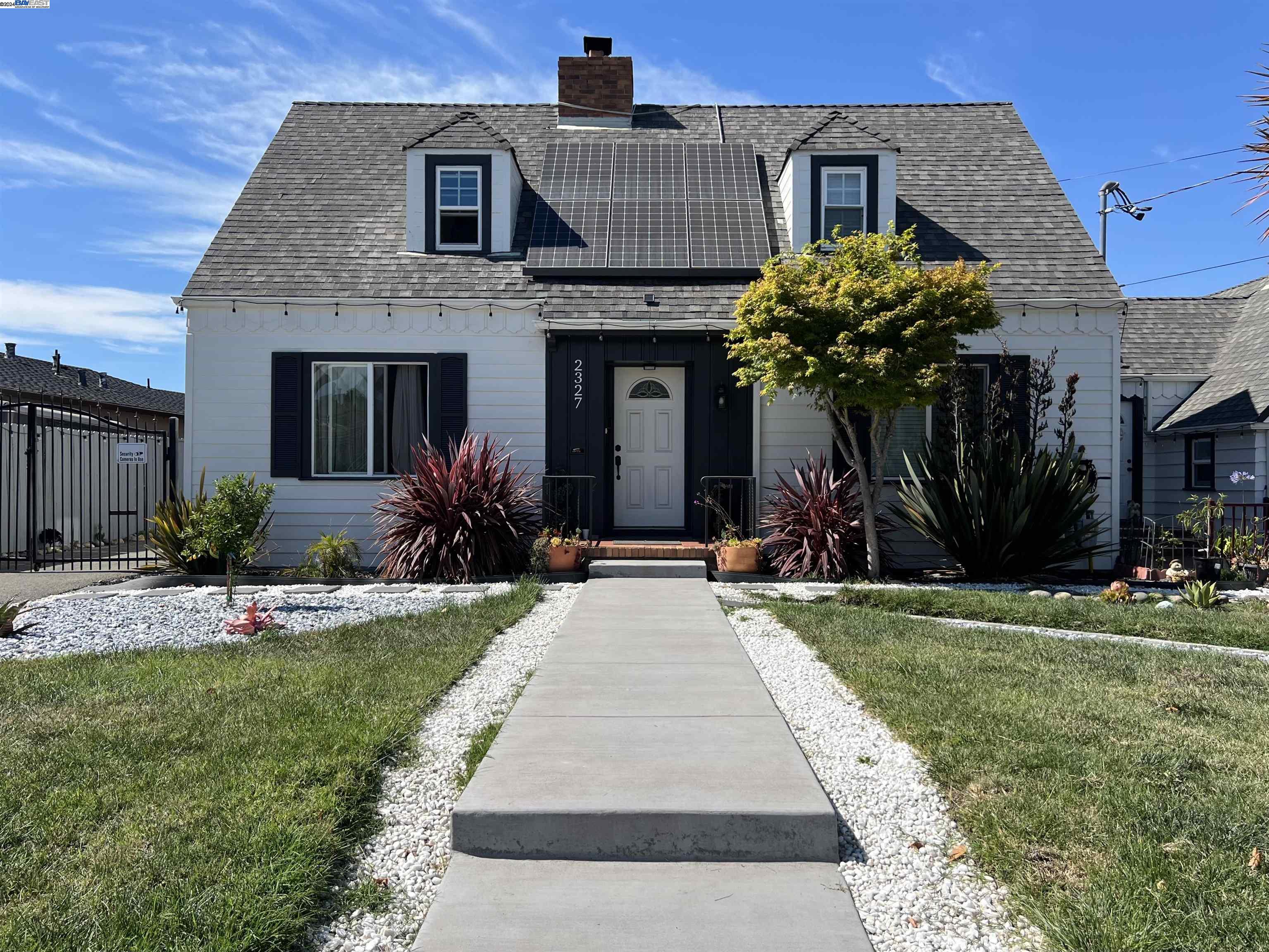 a front view of a house with yard