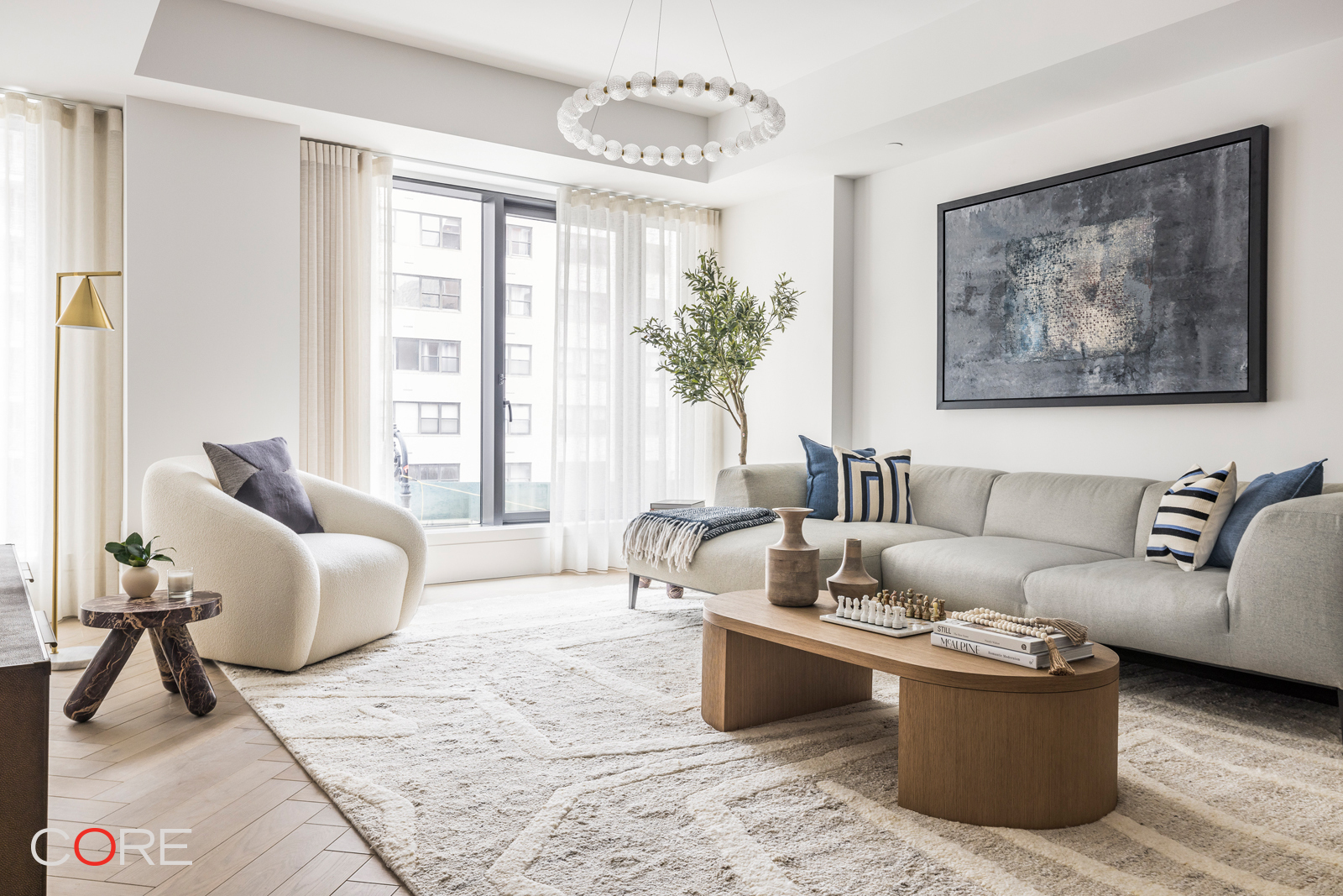 a living room with furniture and a large window