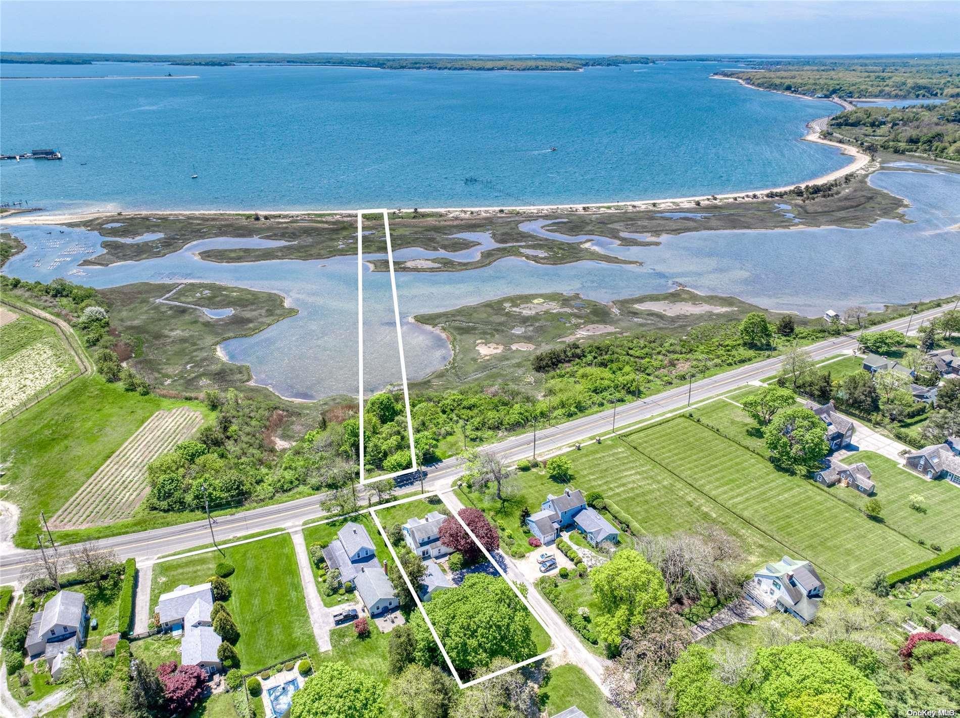 Aerial view showing gazebo on a tranquil creek that leads out over the meadow to your own private beach, and has stunning views of Orient Harbor