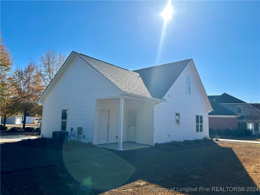 a view of house with yard