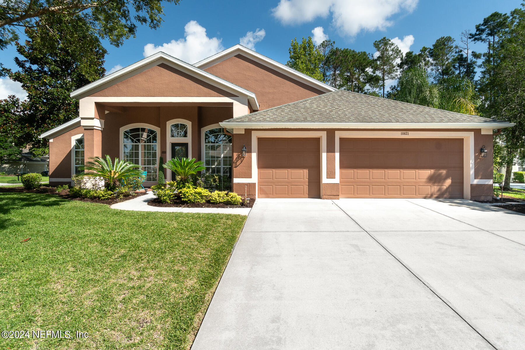 a front view of a house with a yard