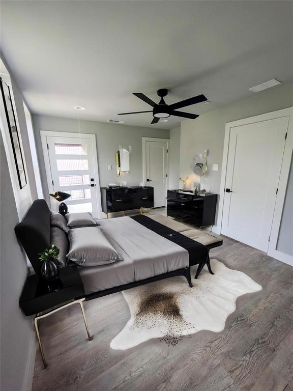 a living room with furniture and a ceiling fan