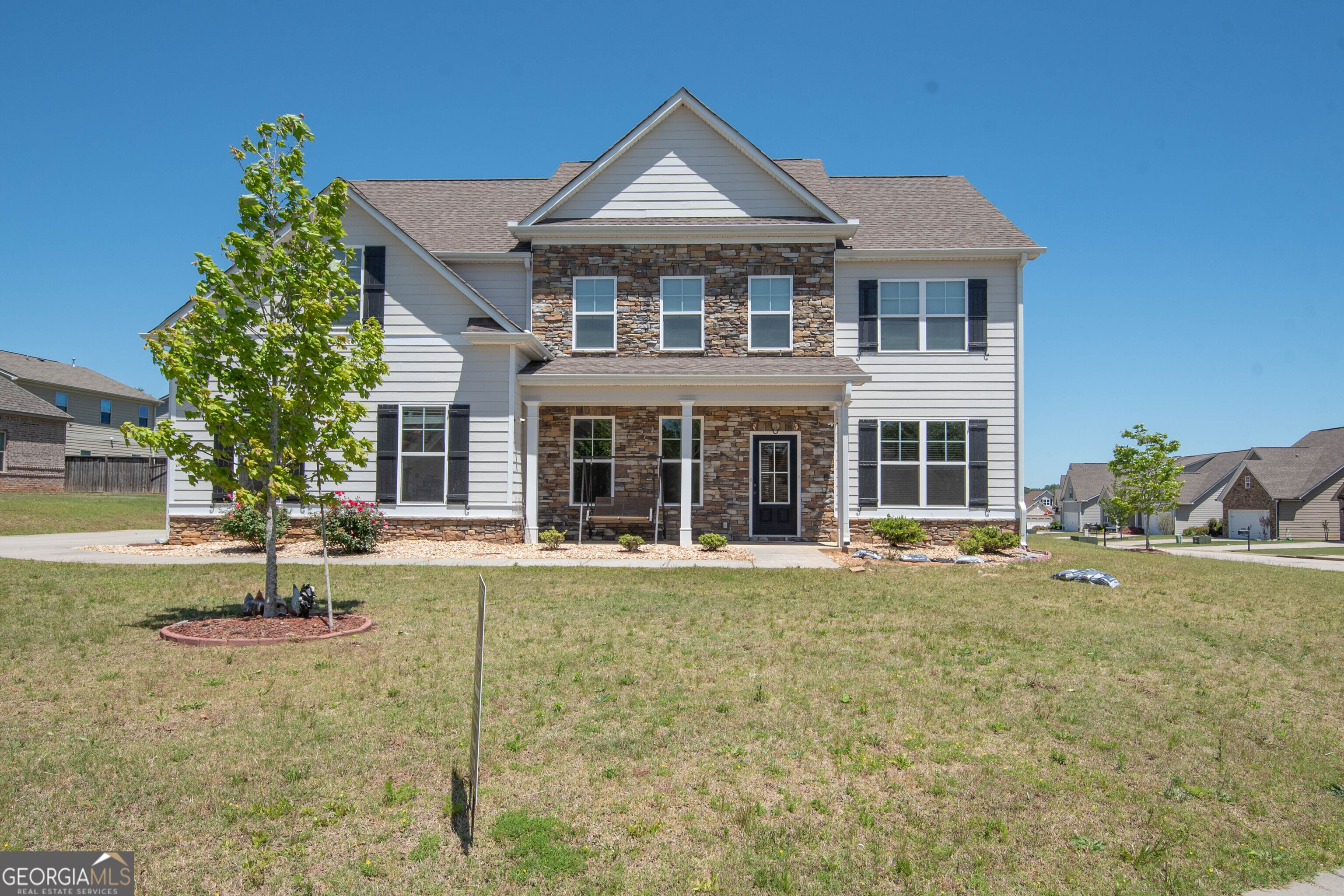 a front view of a house with a yard