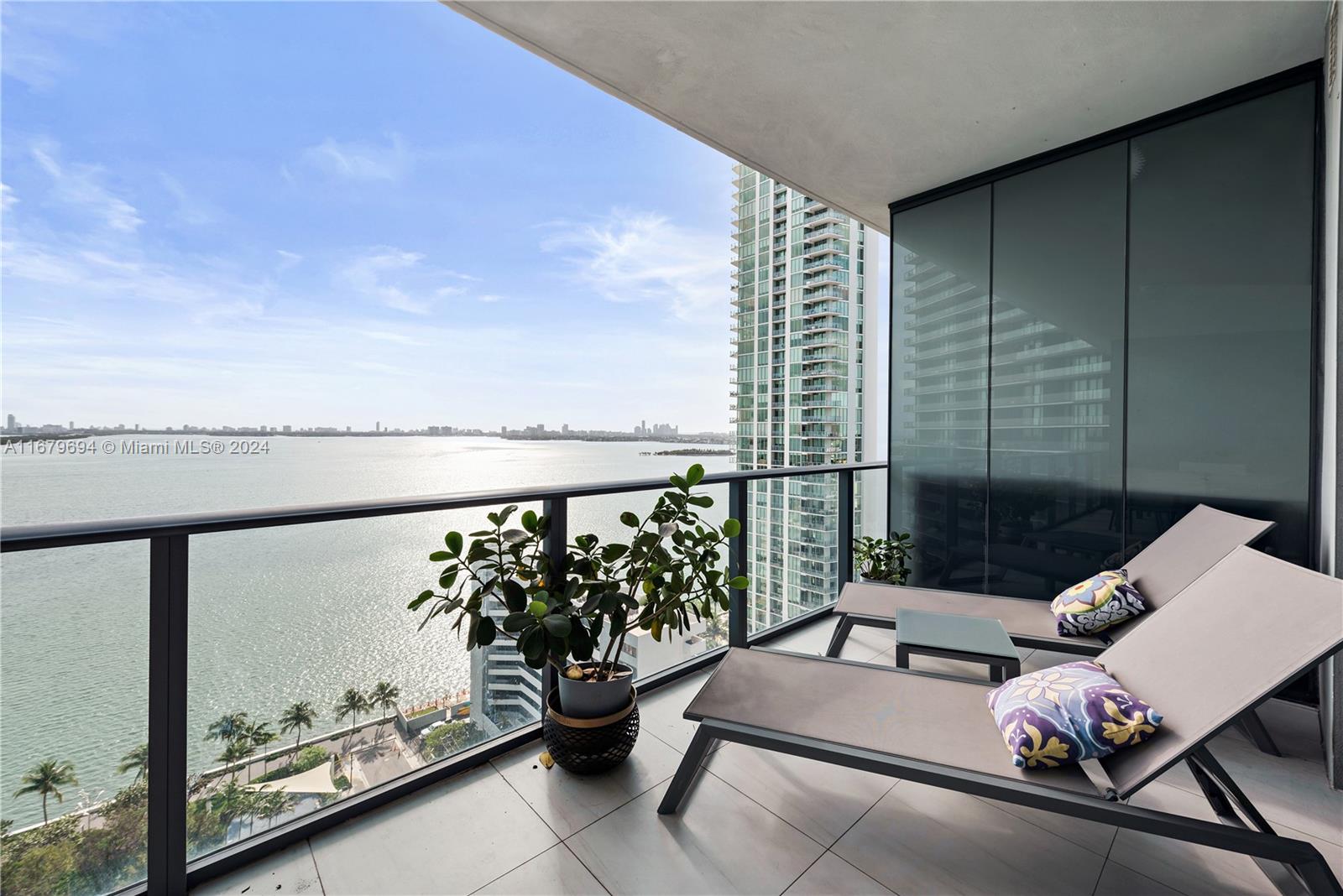 a balcony with chairs and wooden floor