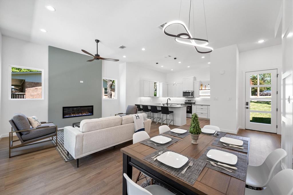 a living room with furniture and kitchen view