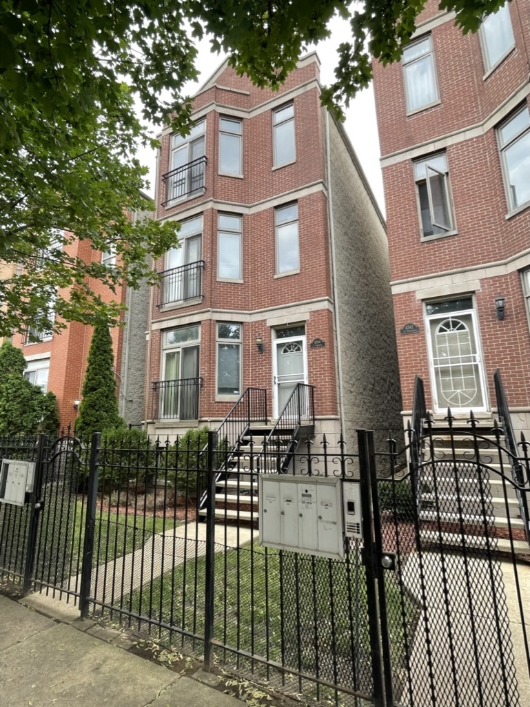 a view of a brick building with many windows