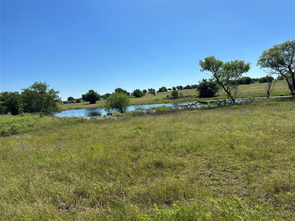 a view of a lake with houses in the back