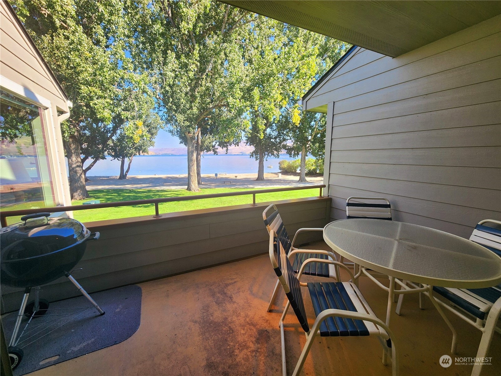 a room with pool table and chairs