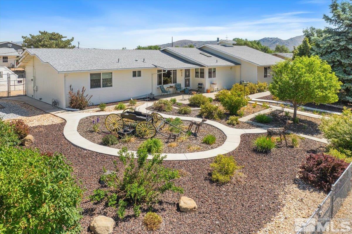 a house with lots of trees in the background