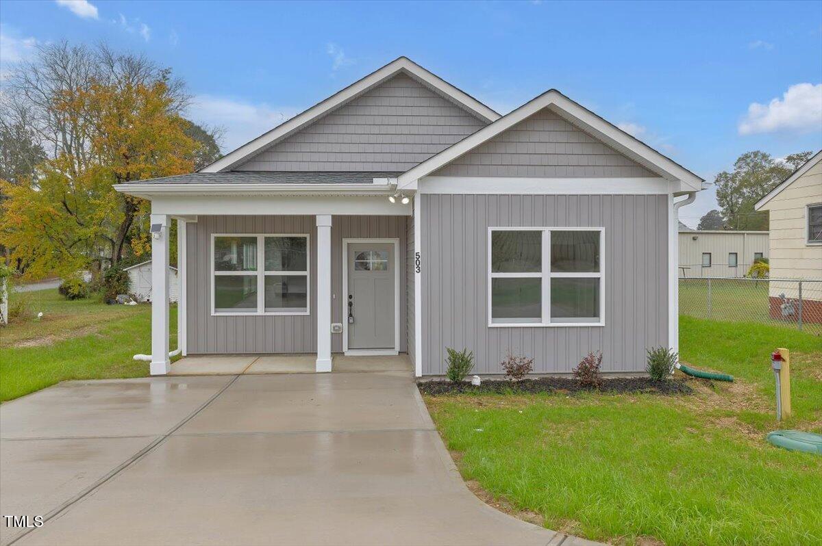 front view of a house and a yard