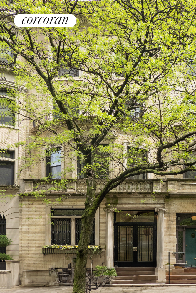 a building with a tree in front of it