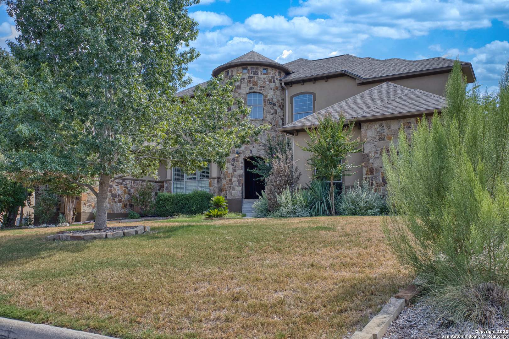 a front view of a house with a yard