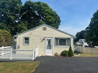 a front view of a house with yard