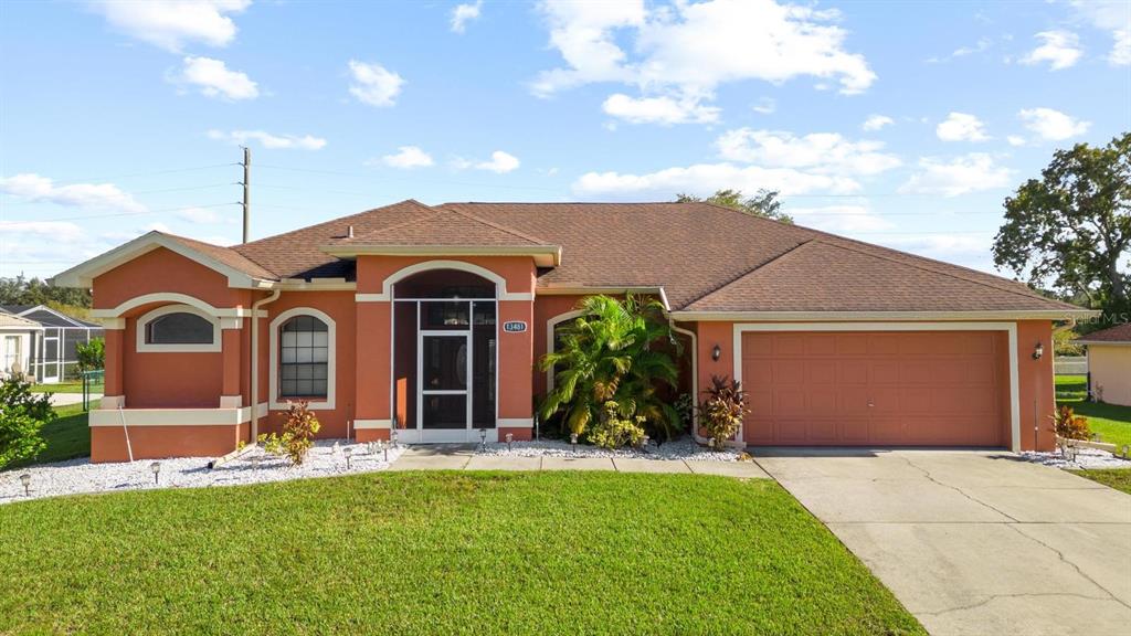 a front view of a house with a yard