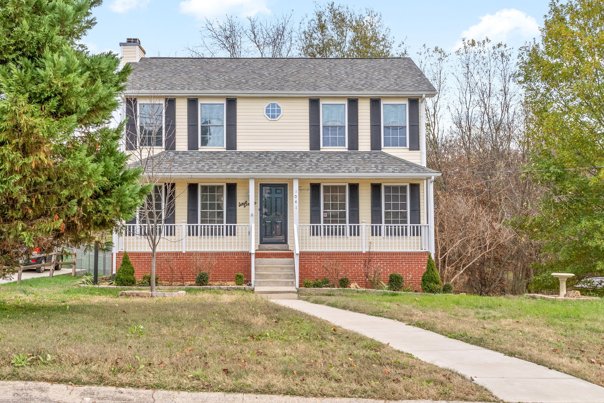 front view of a house with a yard