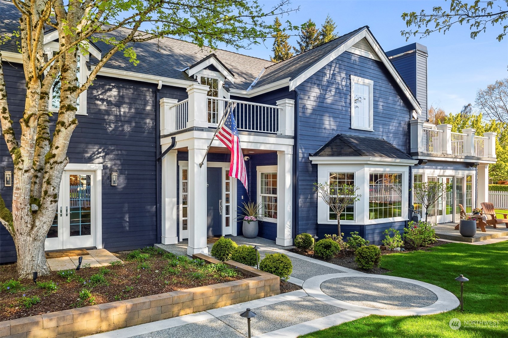 a front view of a house with garden