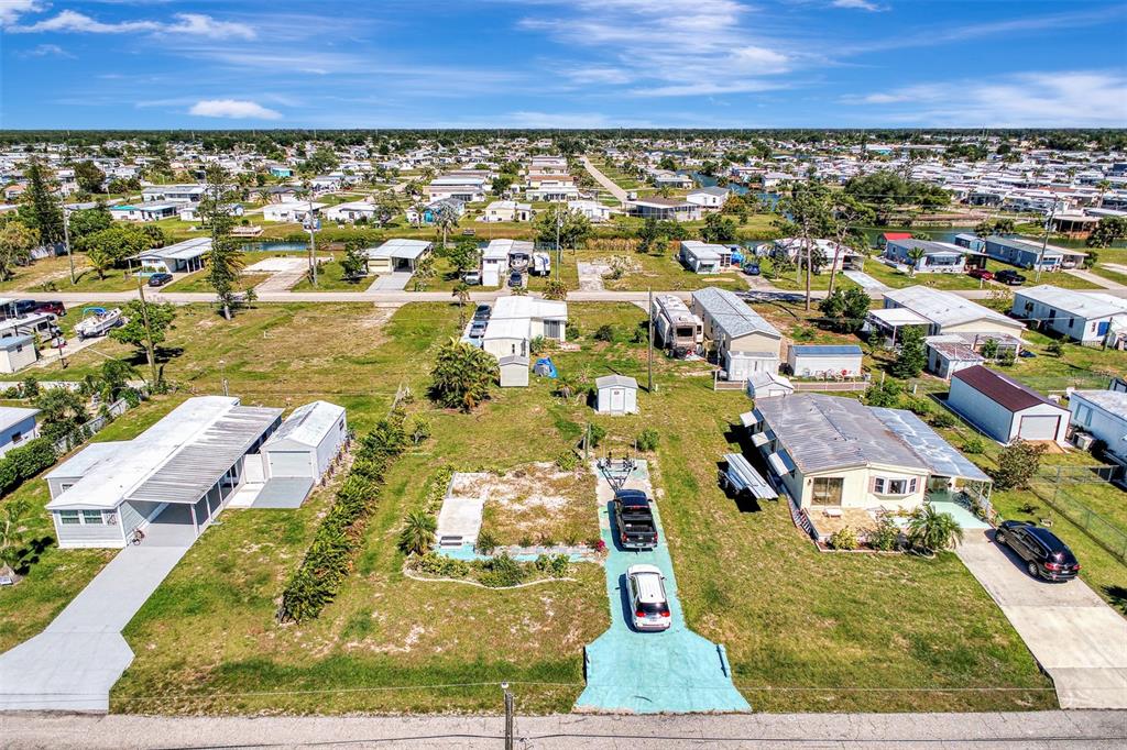 an aerial view of residential houses with outdoor space