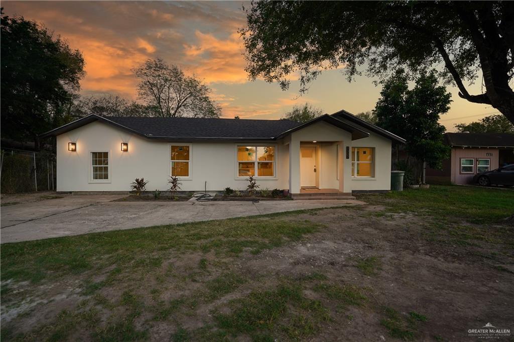 Ranch-style house with a yard