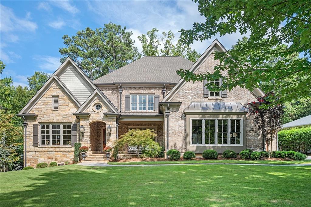 front view of a house with a yard