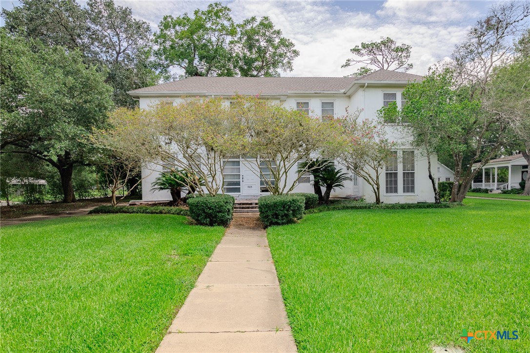 front view of house with a yard