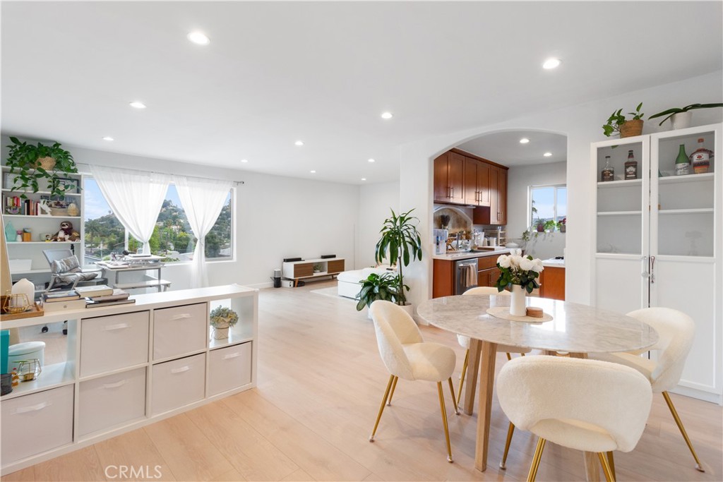 a kitchen with stainless steel appliances kitchen island granite countertop a sink and cabinets