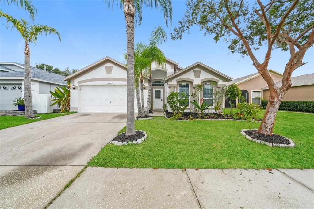 a front view of a house with a yard