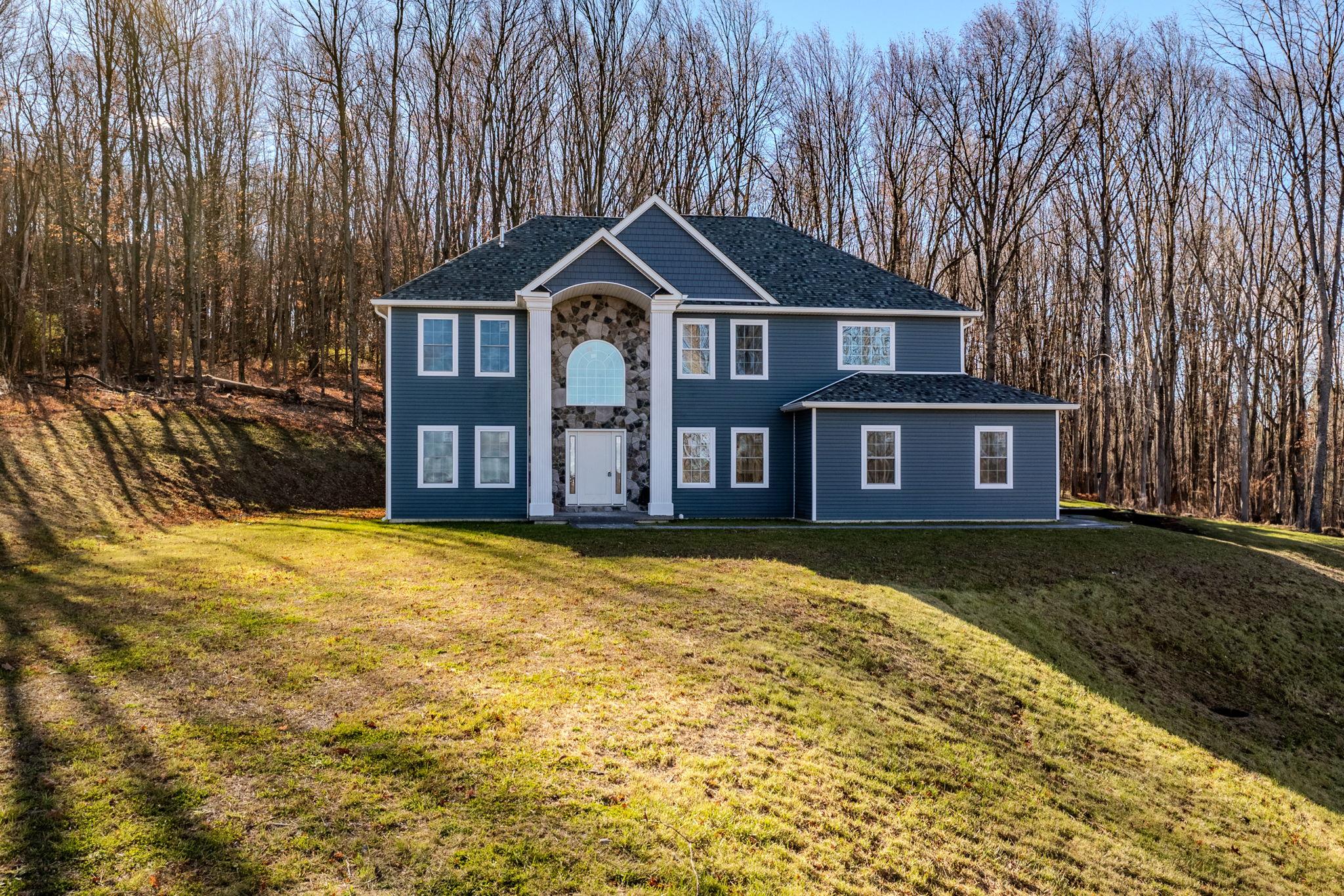 View of front of home featuring a front lawn