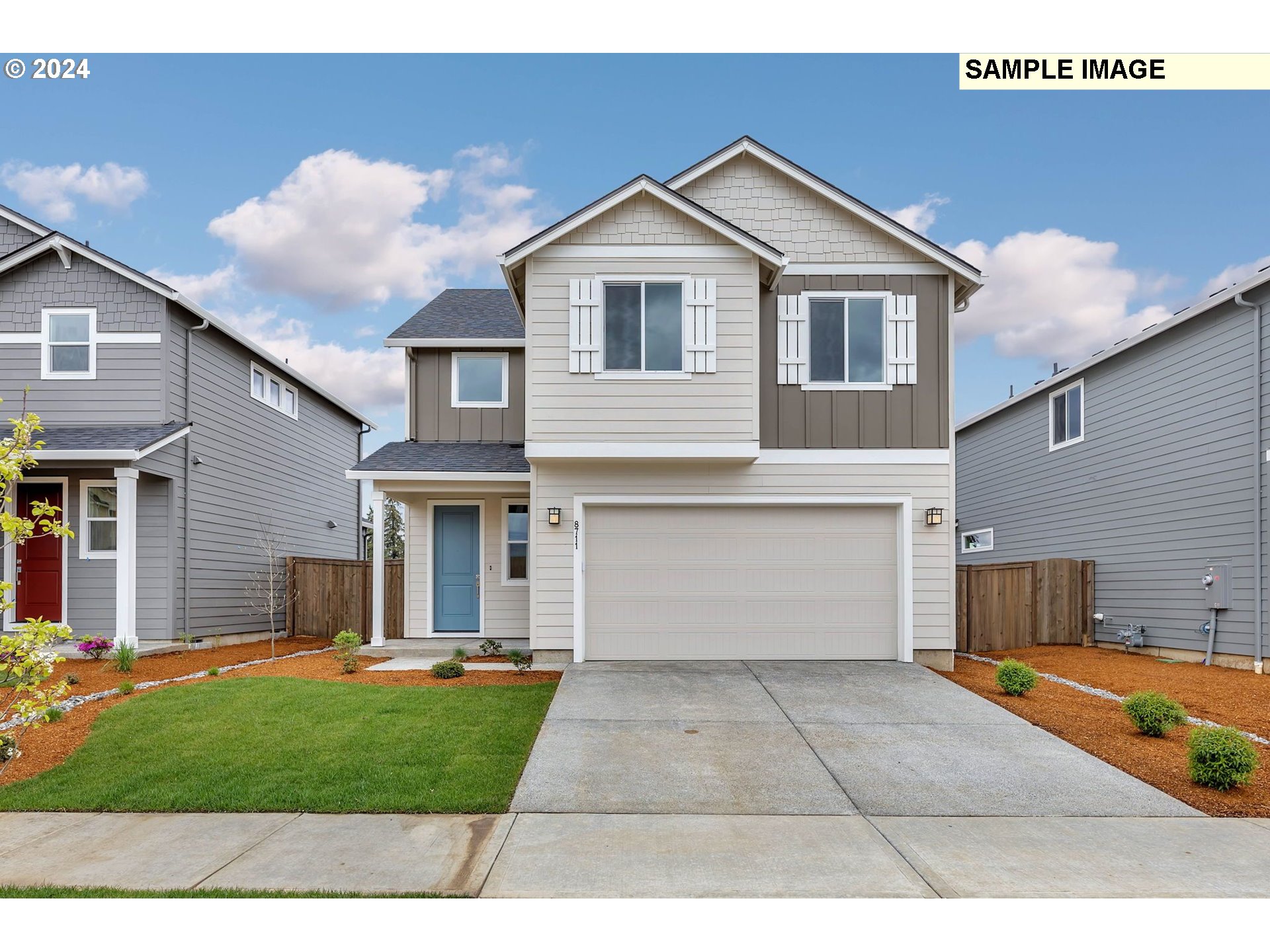 a view of a yard in front view of a house