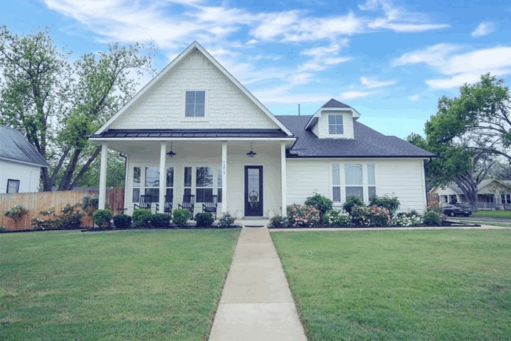 a front view of a house with a yard