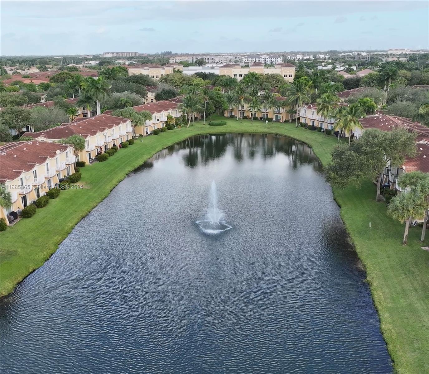 an aerial view of a house with lake view