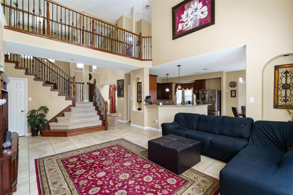 a living room with furniture and a rug