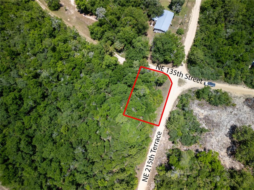 an aerial view of residential house with outdoor space