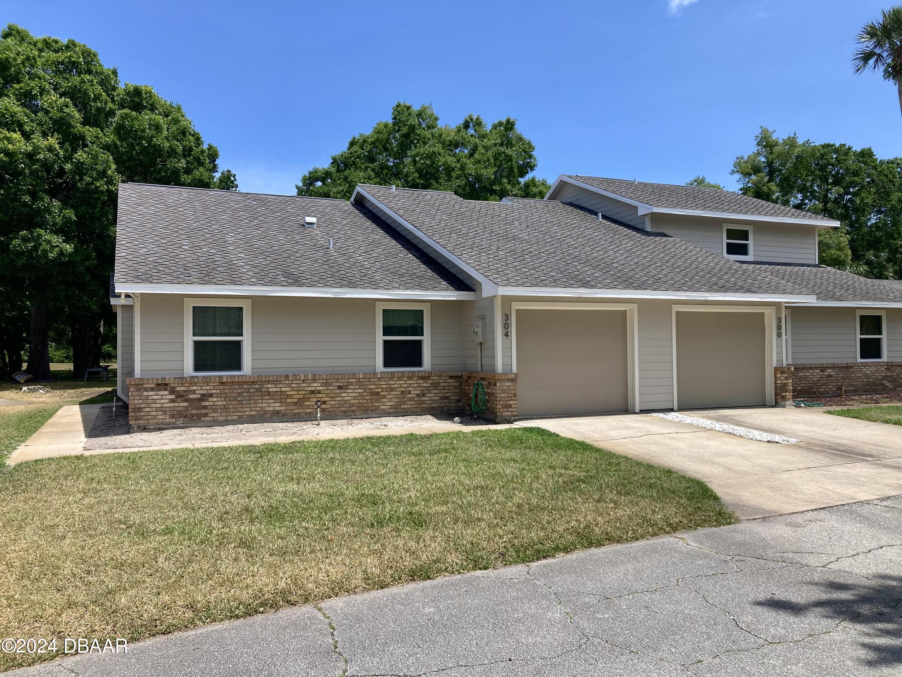 front view of a house and a yard