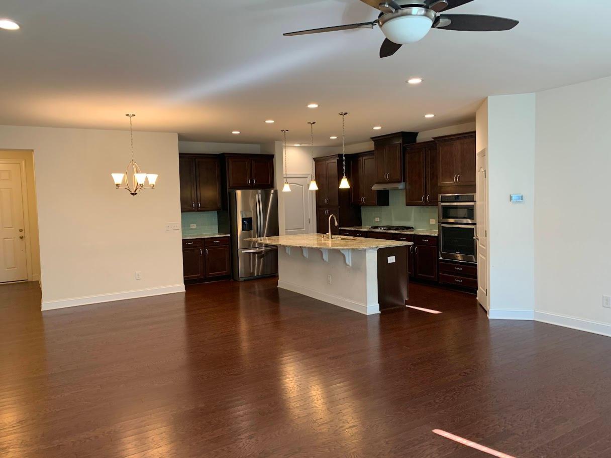 a view of kitchen with cabinets and stainless steel appliances