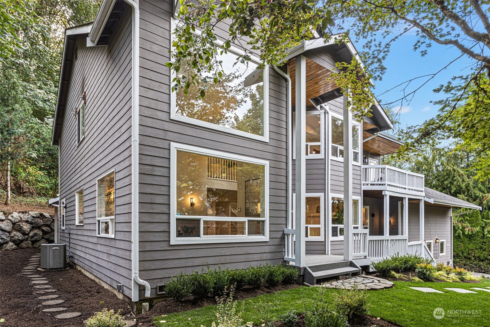 a view of a house with a yard and plants