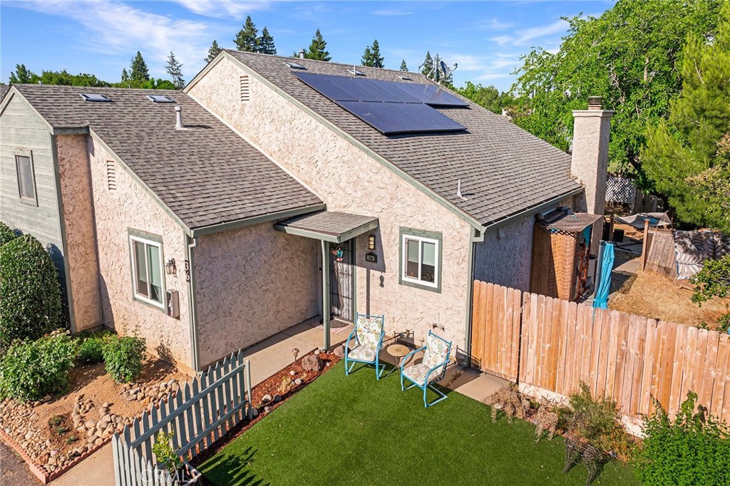 a aerial view of a house with a yard