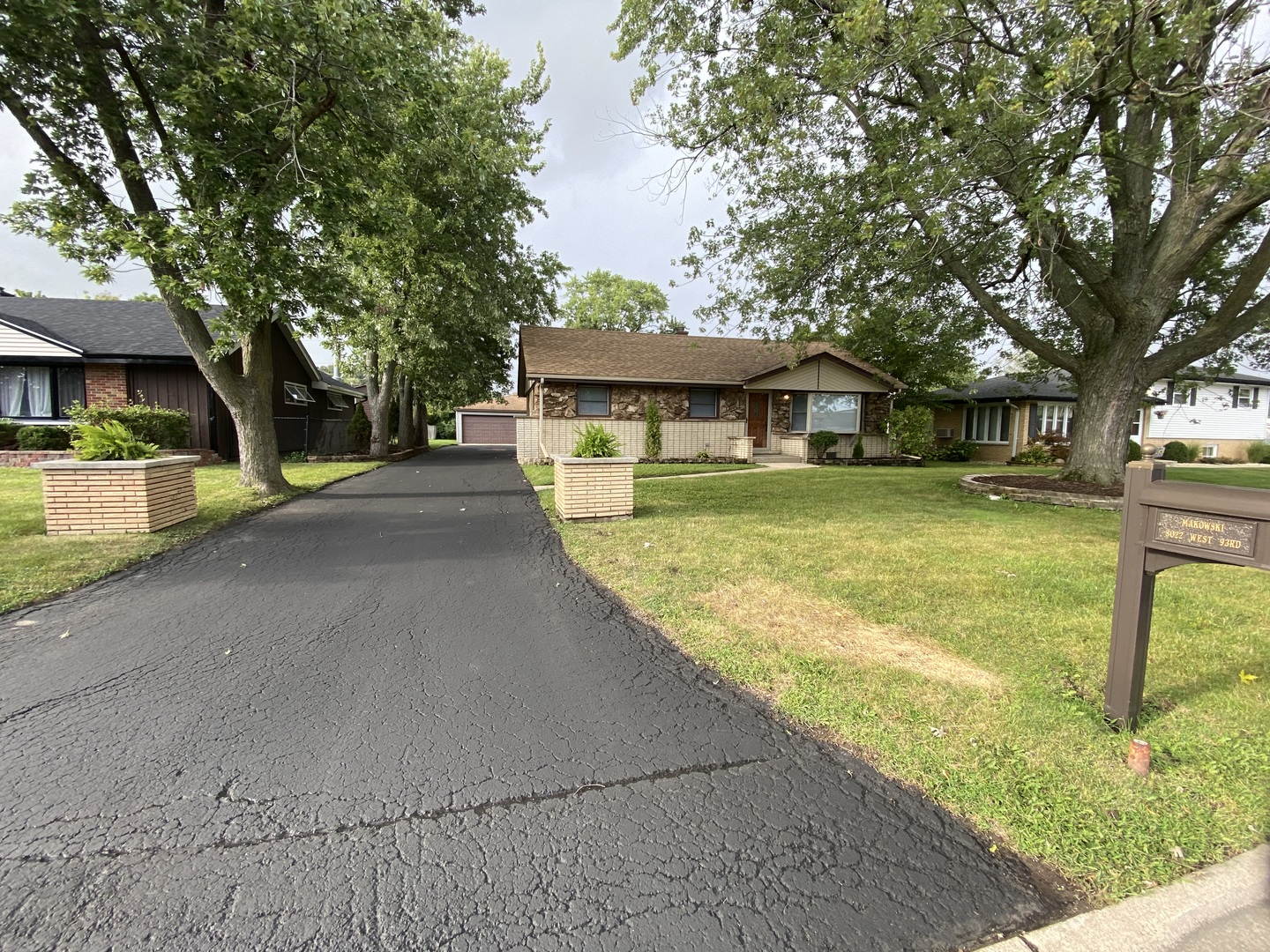 a view of a house with pool and a yard