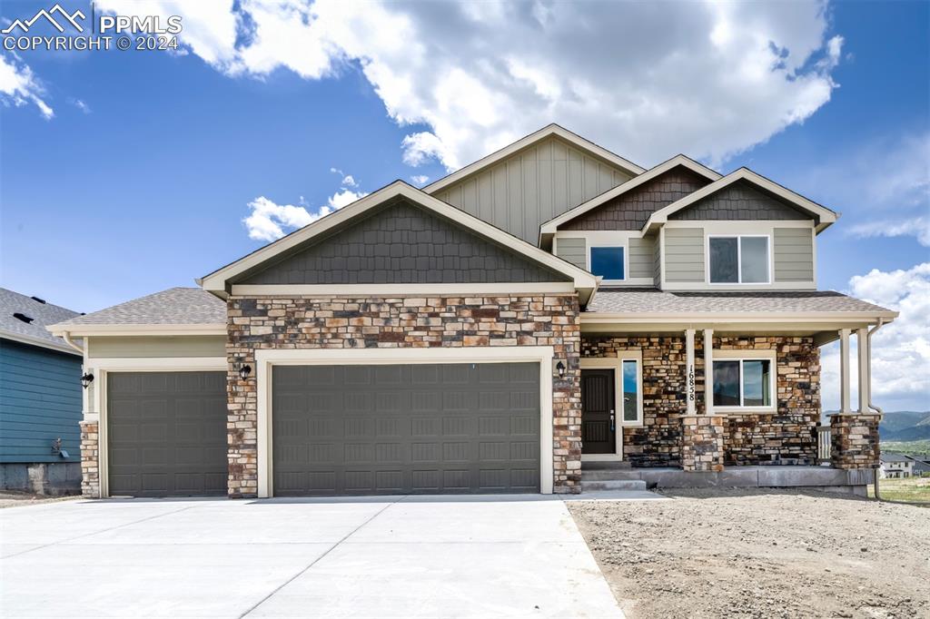 Craftsman-style home with a garage and a porch